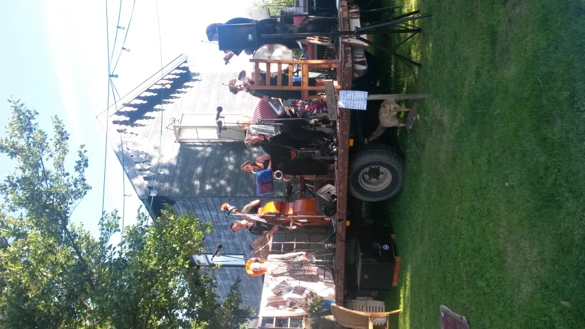 group of people in costumes performing on the back of a truck