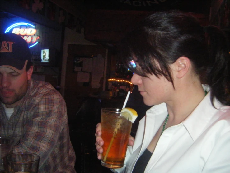 two men in a bar are enjoying drinks