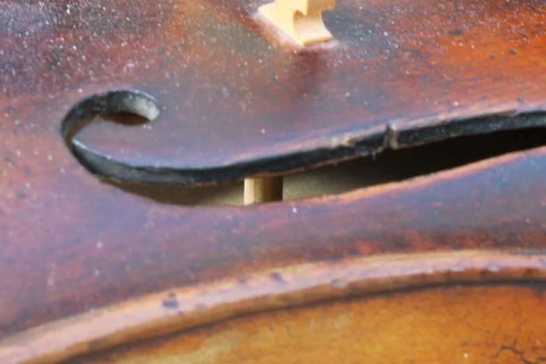 a closeup s of the corner of an old piece of furniture