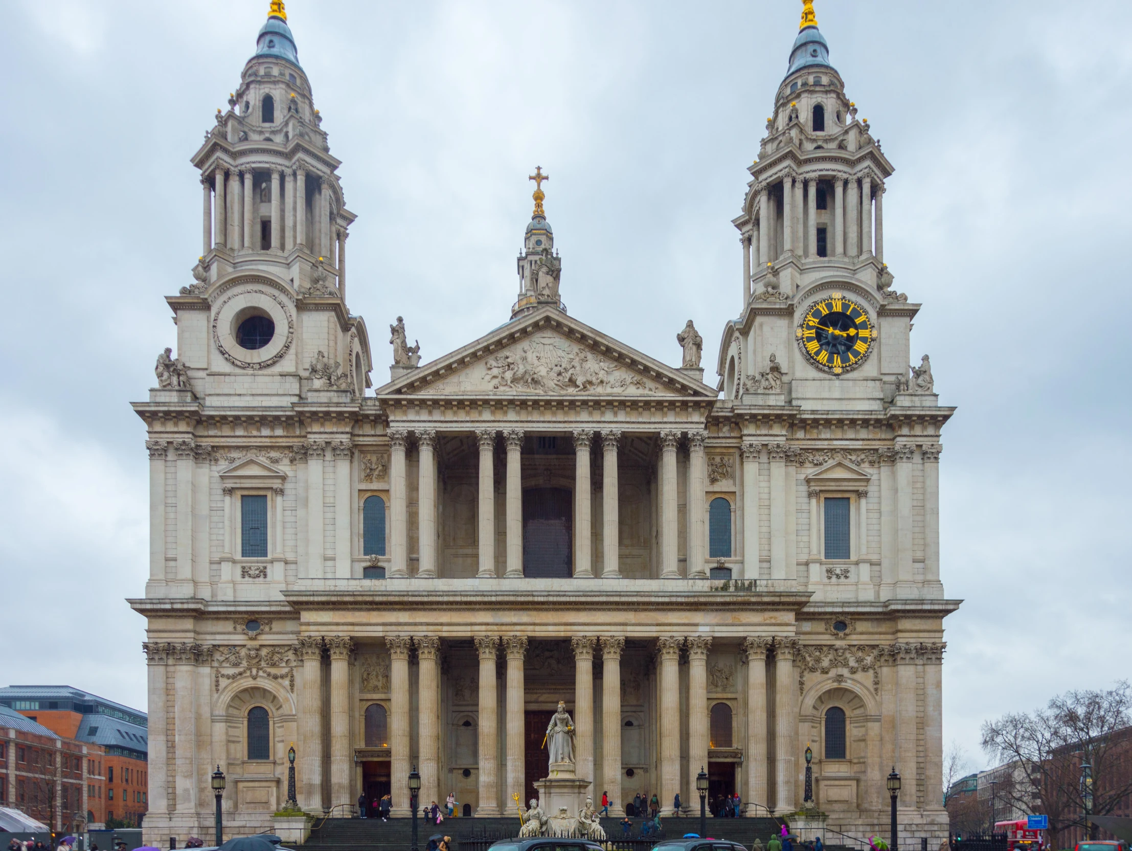 a building has two tall towers with many spires