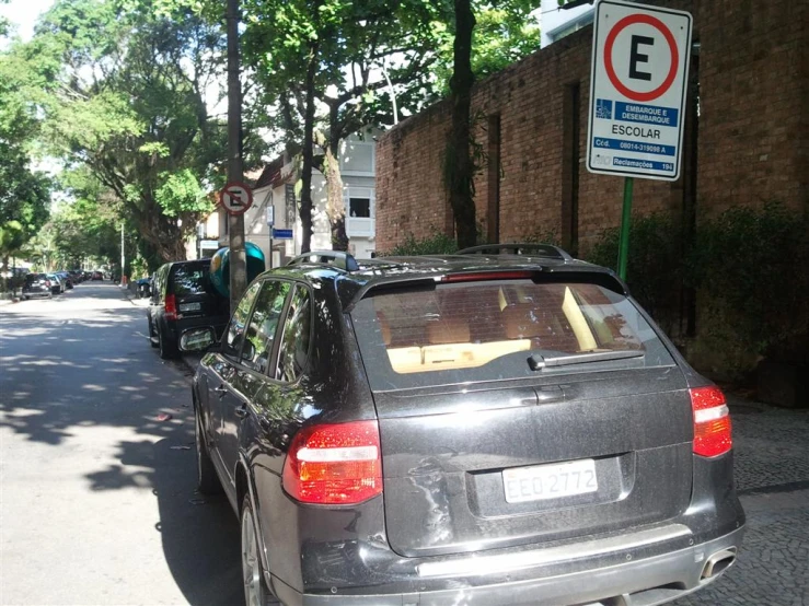 an suv is parked on the street outside