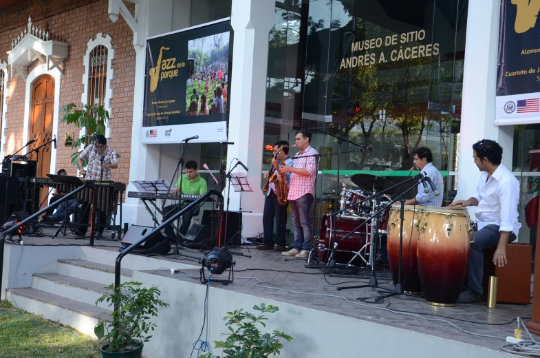 a group of children are playing music outside