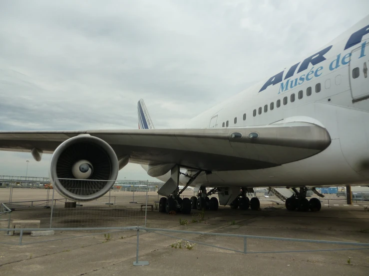 the nose of a passenger plane parked at an airport