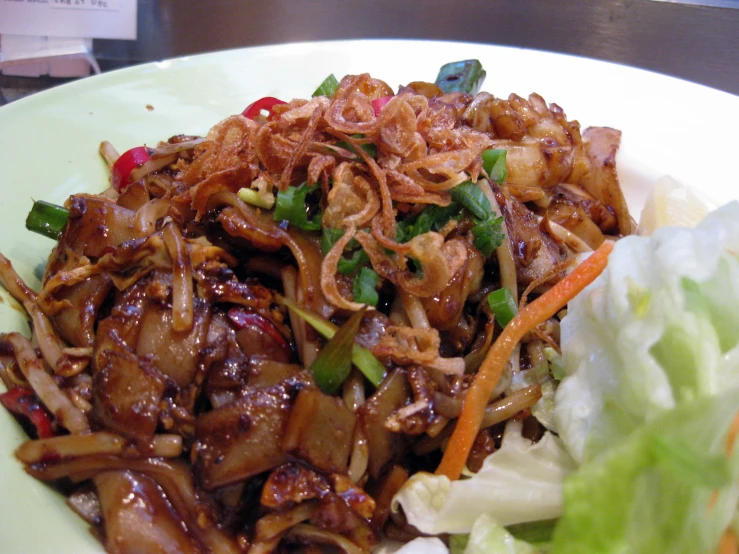 a close up of a plate of food with meat