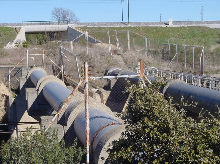 a train yard with pipe piles in between rows