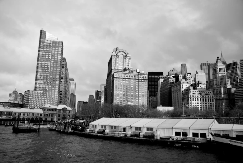 the view of tall buildings in a cloudy skyline