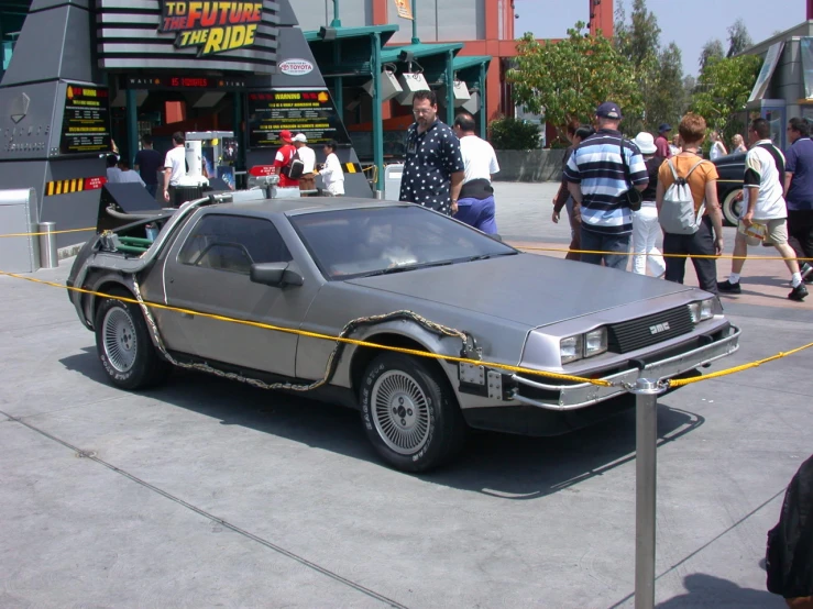 the delorean is parked on a street outside at the party