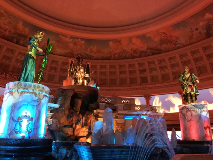 statues and fountains in an elaborate building
