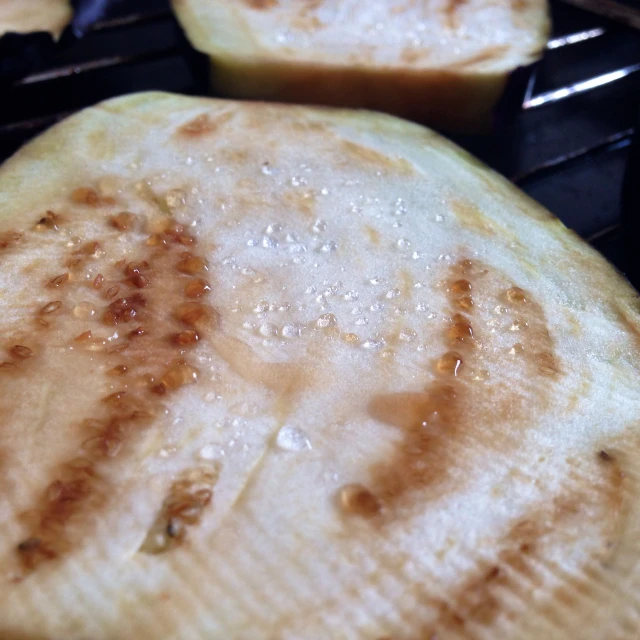 baked potato patties being roasted on the grill