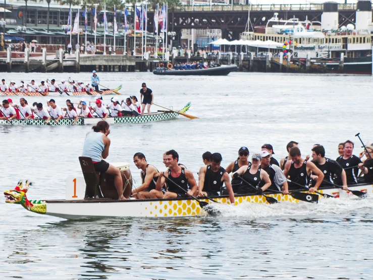 a row boat racing team in the water