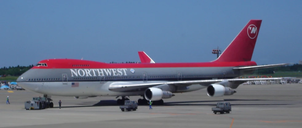 a large passenger plane parked on top of an airport tarmac