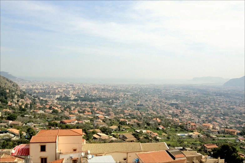 a view of a city skyline taken from a hilltop