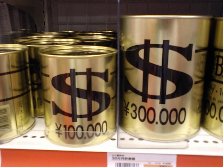 a shelf in a store has gold cans with a dollar symbol