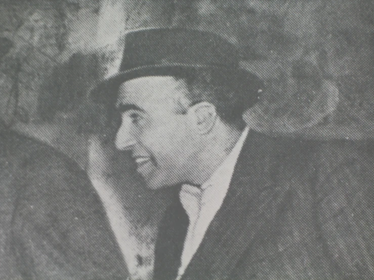 black and white image of two men talking in a bar