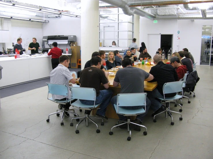 people sit at tables while looking around