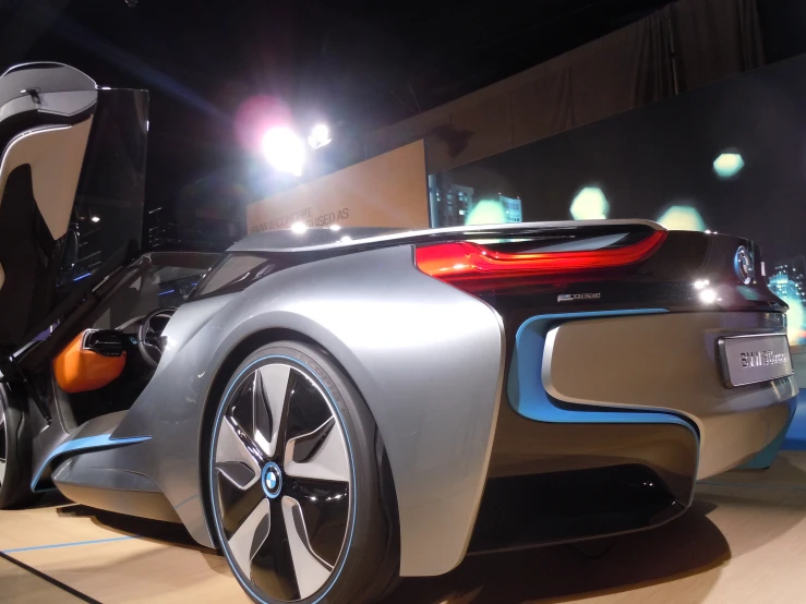 the side view of the bmw concept car on display at a trade show