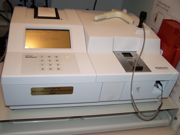 a white machine with a white keyboard on it