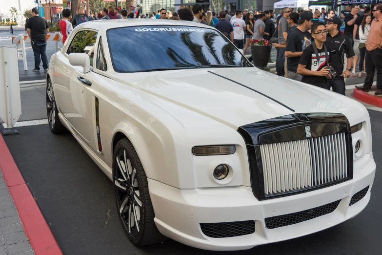 there is a white rolls royce with black trim