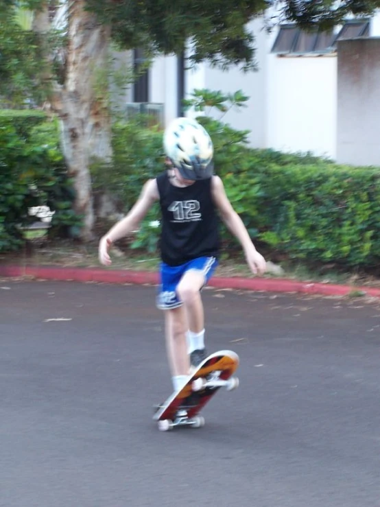 the young skateboarder is riding a small skateboard