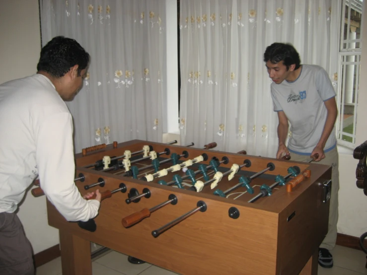 two men are playing a game of chess