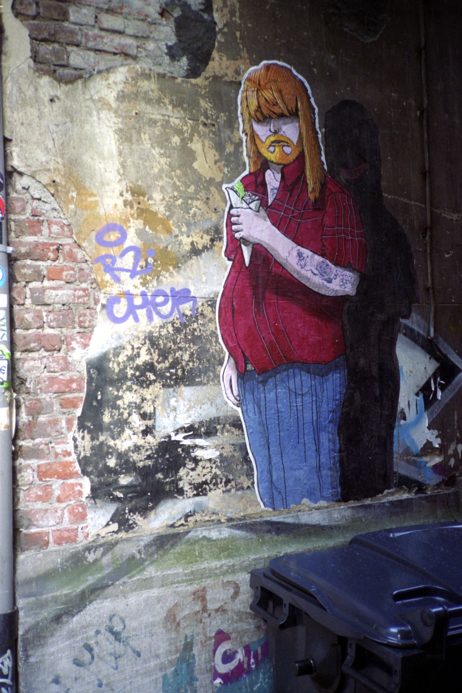 a mural on the side of a building featuring a woman wearing glasses