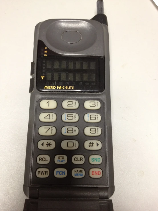 an old calculator sitting on a desk with no top