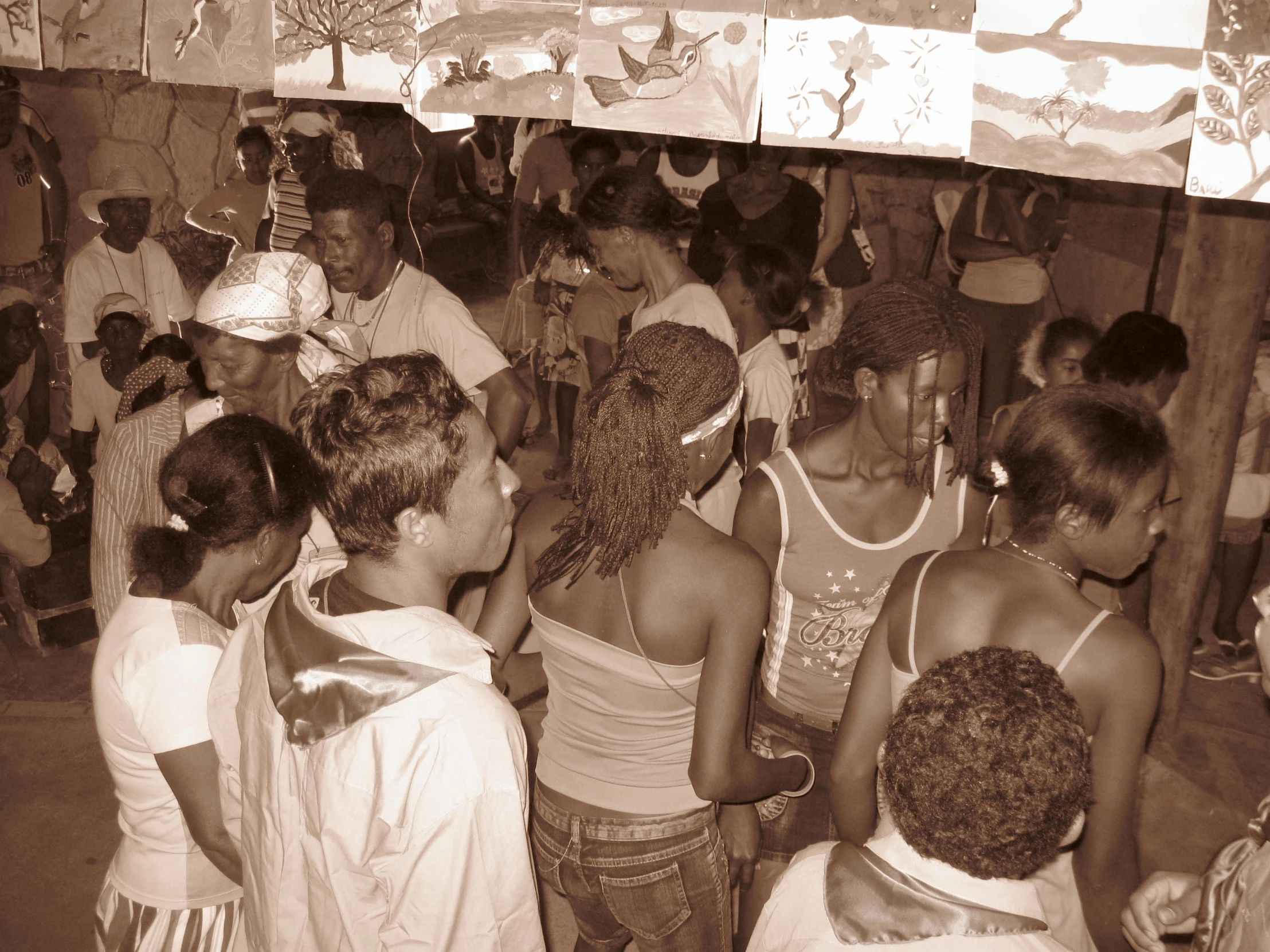 the dancers are crowded together in front of the big tent