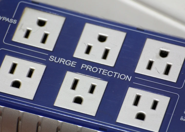 the four surge protectors are labeled on a blue surface