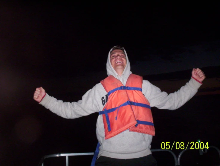 a man dressed up in an orange life jacket