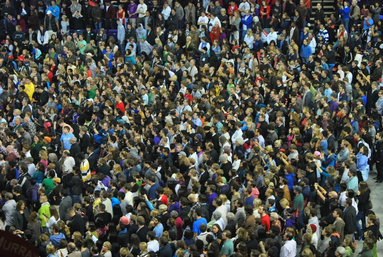 a large group of people standing in a crowd