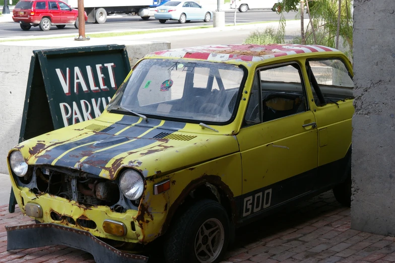 a yellow van is on display in a park