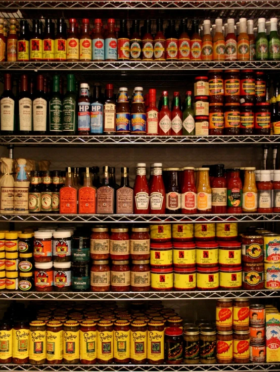 several shelves filled with many different types of food