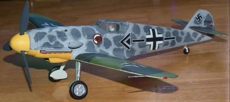 a toy military plane sitting on top of a table