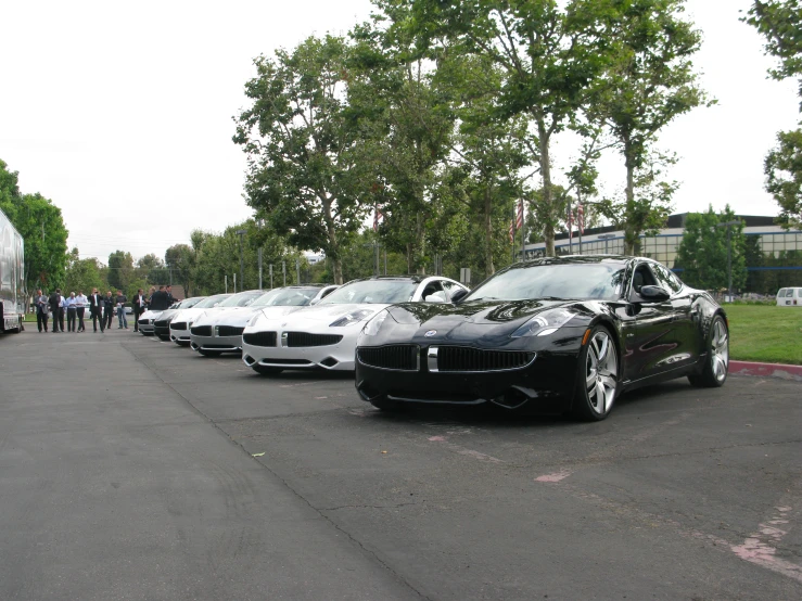 a row of cars that are parked in a parking lot