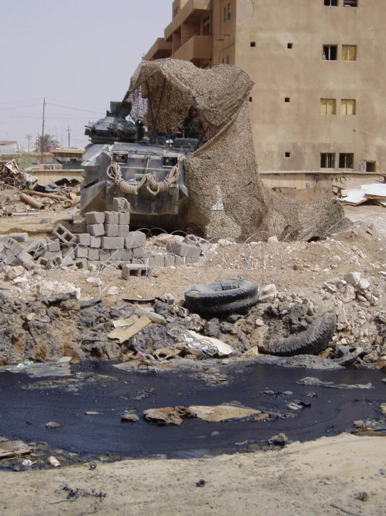 the remains of an army tank, and a tank sitting on top of it