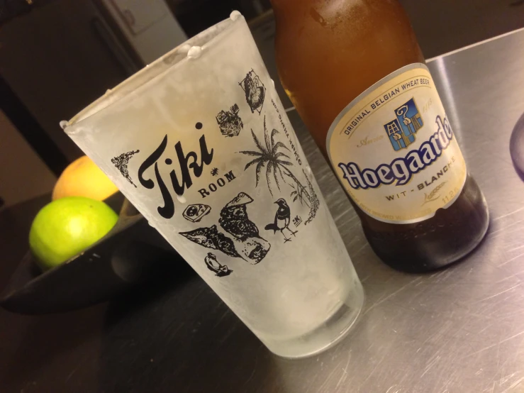 two empty beers are sitting on a bar top