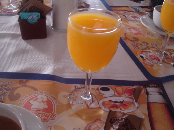 the orange juice has been made and served in this glass