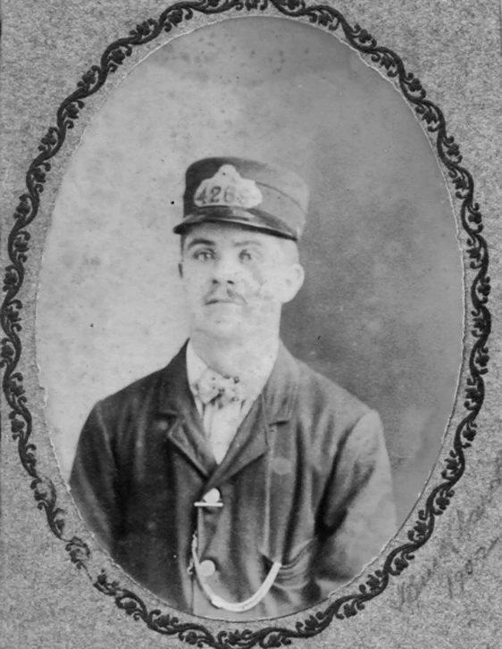 an old pograph of a man in uniform