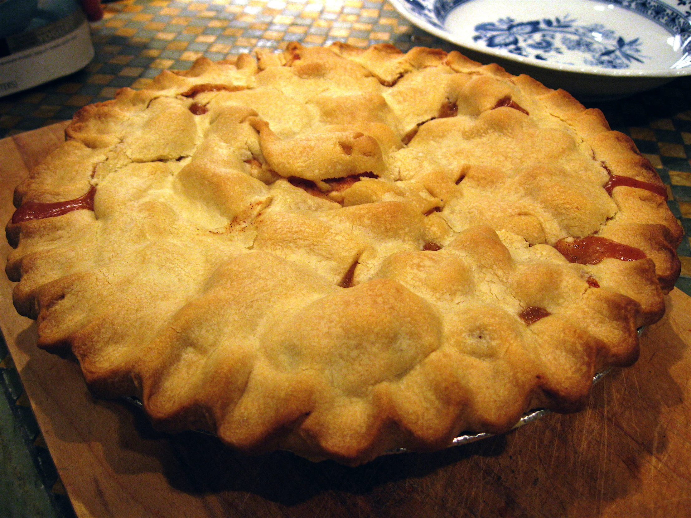 a pie sits on a wooden table