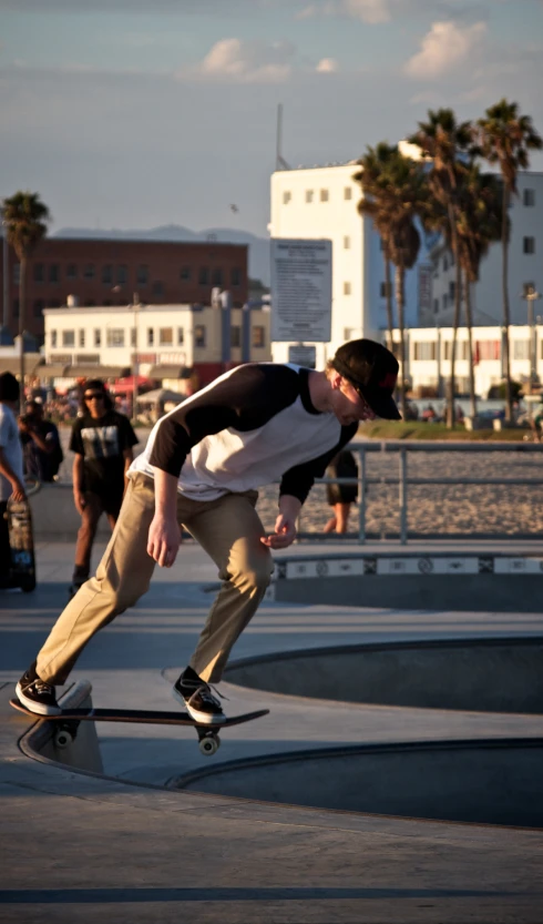 a  skating down a railing on his skateboard