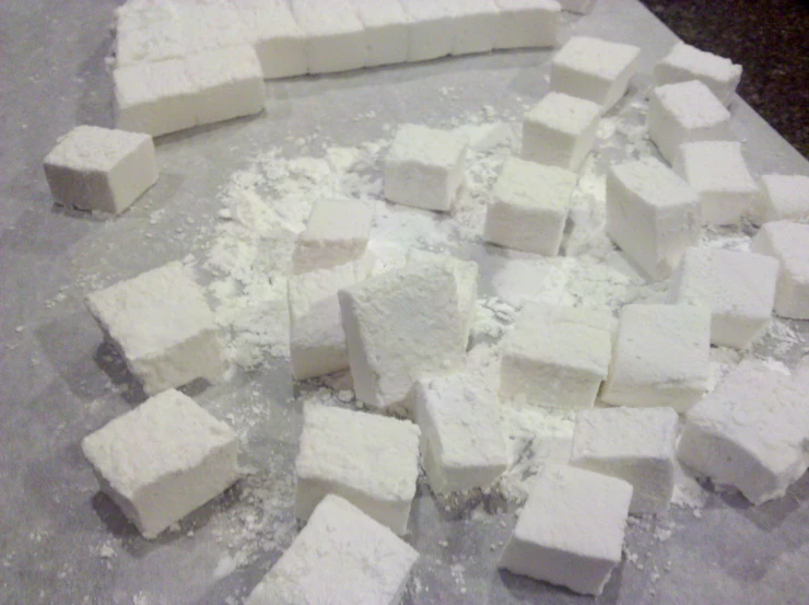 lots of sugar cubes scattered about on the counter