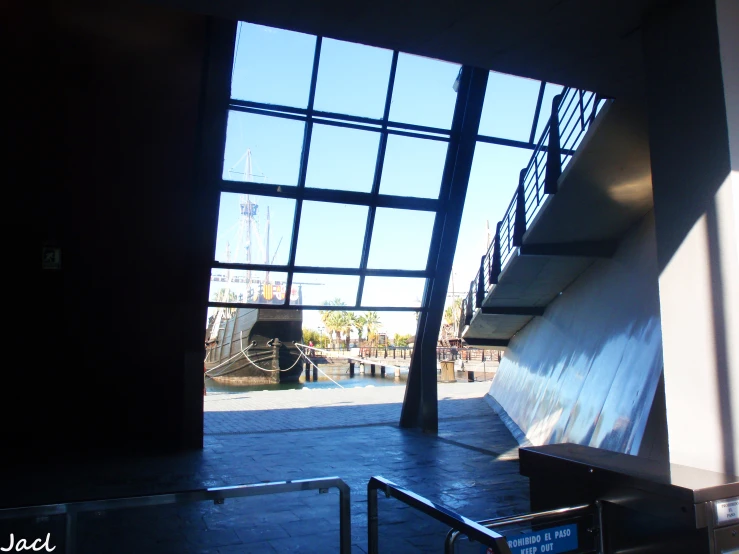 some stairs and a clock inside a large building