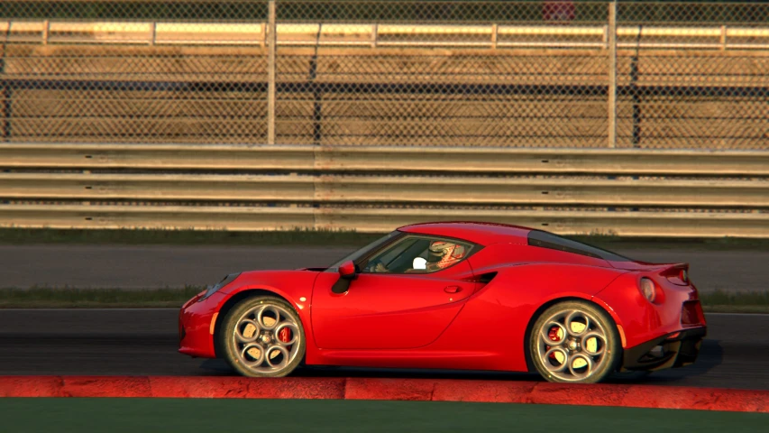 a small red car driving on a track