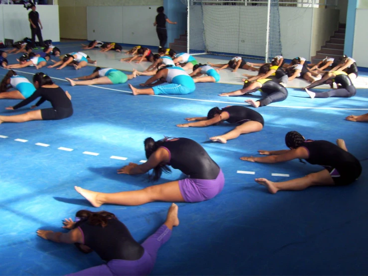 some very pretty women doing exercises in the gym