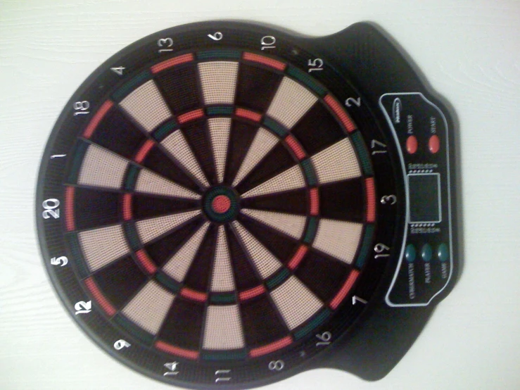 a dart on top of a magnetic board for darts
