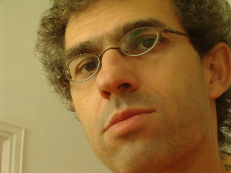 a close - up view of a man wearing glasses