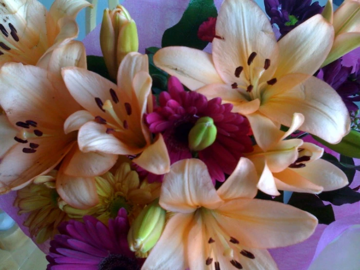 some yellow and red flowers sitting on a table