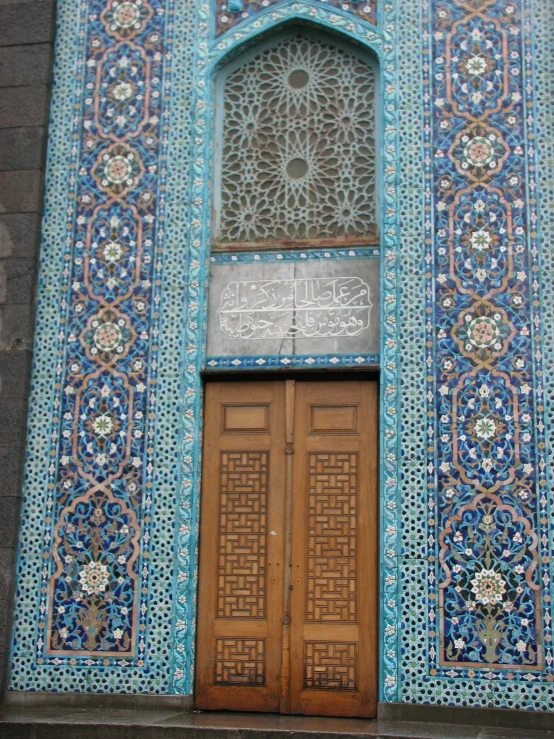 a door with a carved window on top