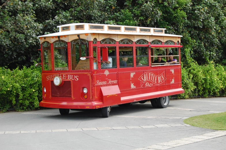 an old trolley is traveling around a corner