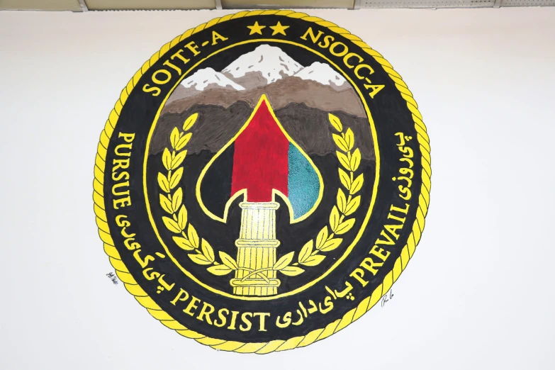 the department of justice logo above a sign on a wall